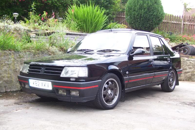 hi heres a few pictures of my peugeot 309 gti 19 its total standard apart