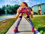 girl on skates taking picture. colorful